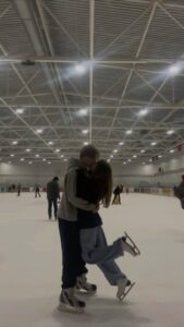 A picture of a couple on a ice skating date