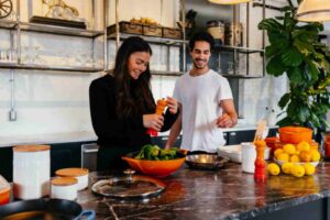 A couple cooking together on a date